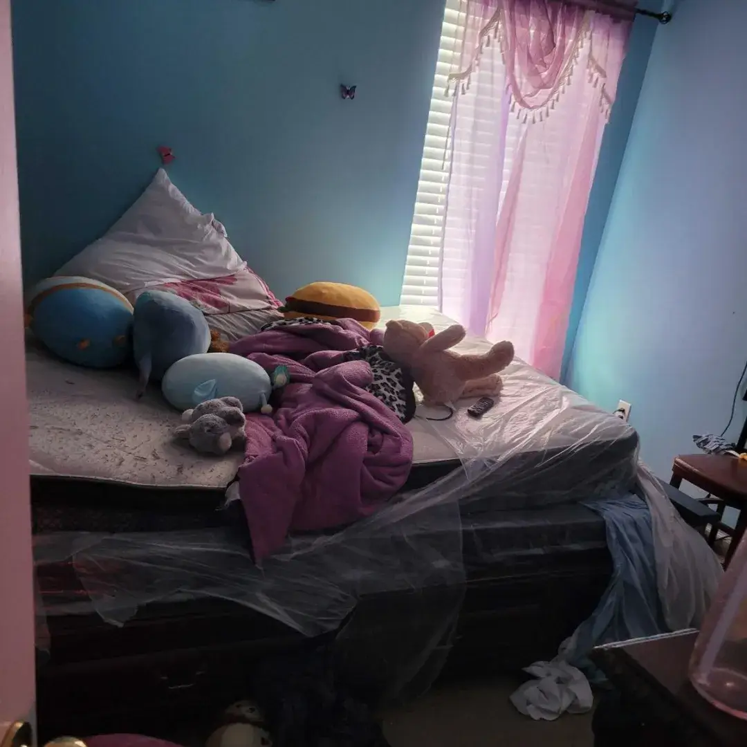 Messy children's bedroom before professional cleaning in McDonough, GA